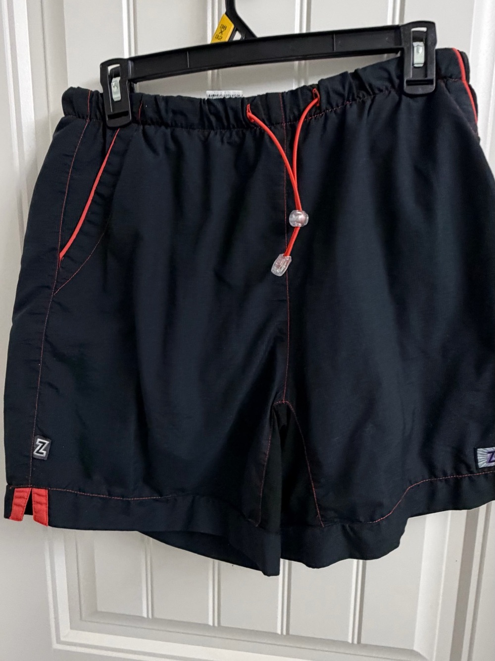 Zoot Black Bike Shorts with Red Accent Trim
